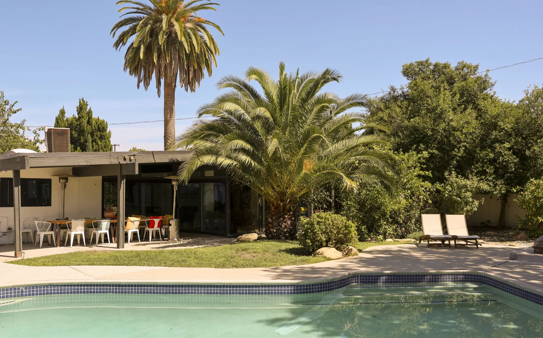 The private pool and mature garden
